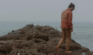 Daren Magee standing next to the sea in The Embroidered Ojai