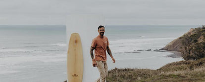 Surfer wearing The Heavy Bag Tee in Dawn Patrol