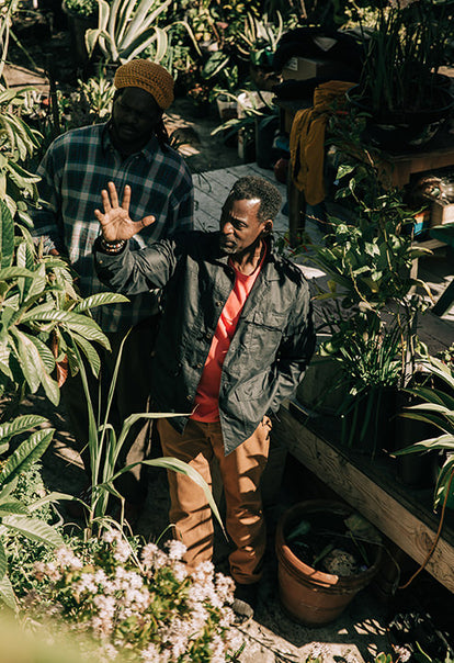 Ron checking on his plants in his community garden.