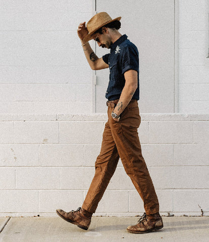 Daren Magee walking in The Embroidered Short Sleeve Western in Indigo Linen