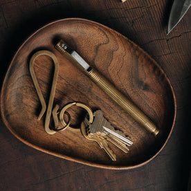 The Keyhook in Raw Brass on a tray, Accessories by Taylor Stitch