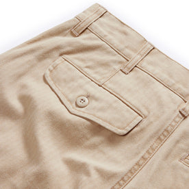 material shot of the back flap pocket on The Matlow Short in Dune Washed Herringbone, Bottoms by Taylor Stitch