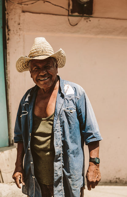 A local fellow, smiling cheerfully at the camera.