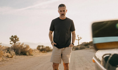 fit model posing on a road in The Cotton Hemp Tee in Charcoal