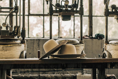 shot of our hat being made in the factory, sixth image in the carousel