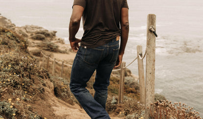 fit model wearing The Democratic Brushed Back Jean in Collins Resin Wash Selvage Denim