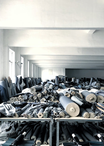 A store room with many bolts of material.