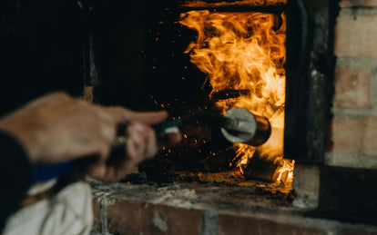 Close up of fire being stoked