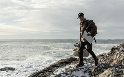 Tim wearing The Longshore Jacket in Dark Oak Waxed Canvas, The HBT Jacket in Washed Olive, and The Morse Pant in Charcoal on the maine coast.