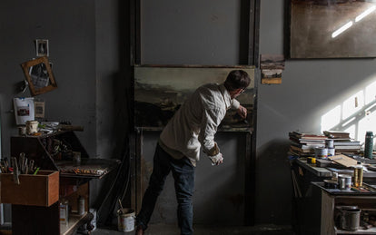 Tim wearing the chore shirt while painting.