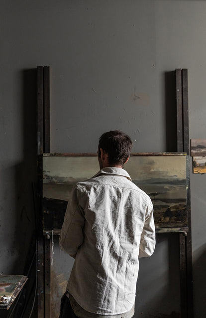 Tim in studio wearing The Chore Shirt in Natural Herringbone.