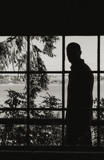 Silhouette of a model by the window.