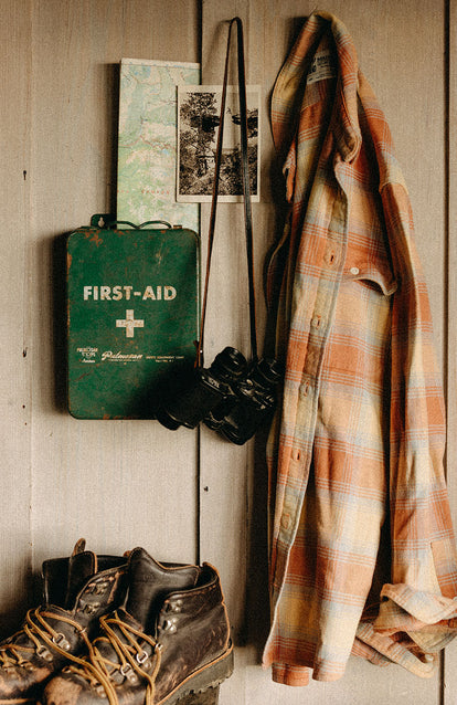 The Ledge Shirt hanging next to vintage items in a shed