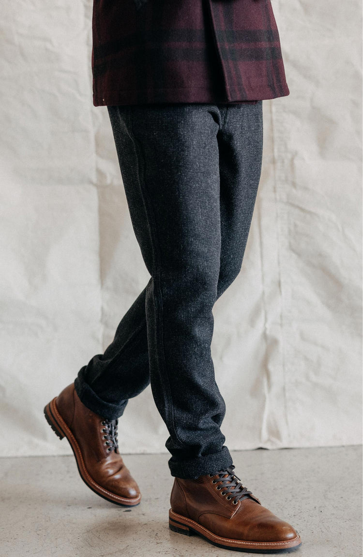 Model wearing The Carnegie Pant in Army Herringbone Wool