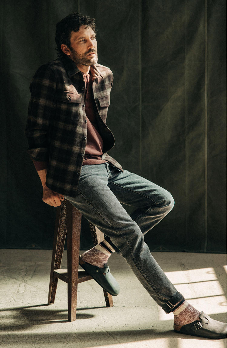 Model wearing The Demo Jean in Black 1-Year Wash Selvage Denim