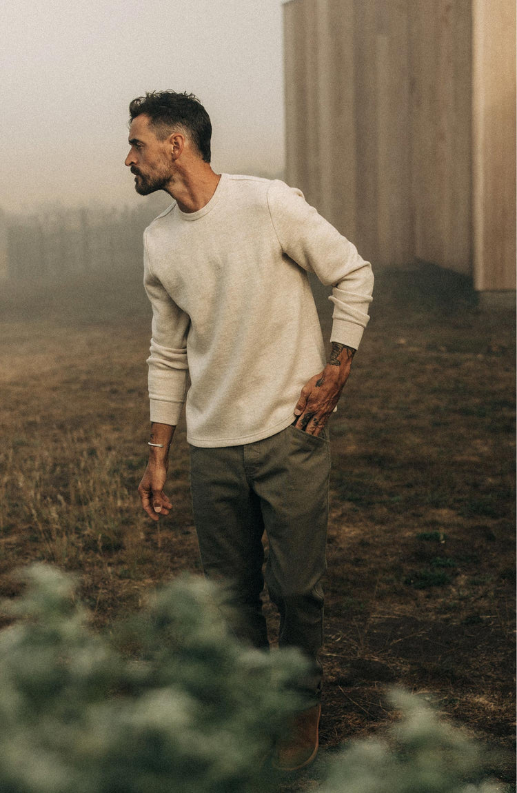 Our model wearing The Evans Crewneck in Oat Birdseye Wool