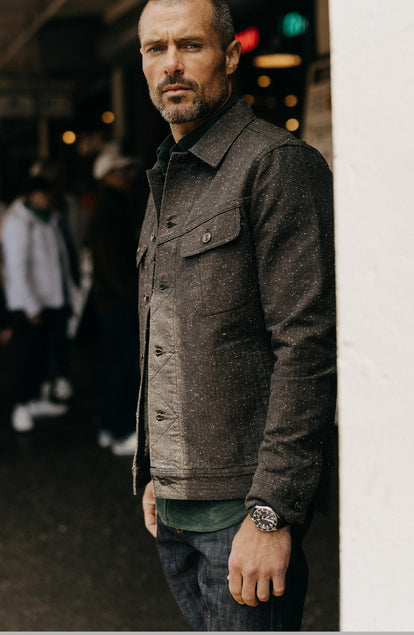 fit model standing wearing The Long Haul Jacket in Peat Nep Herringbone