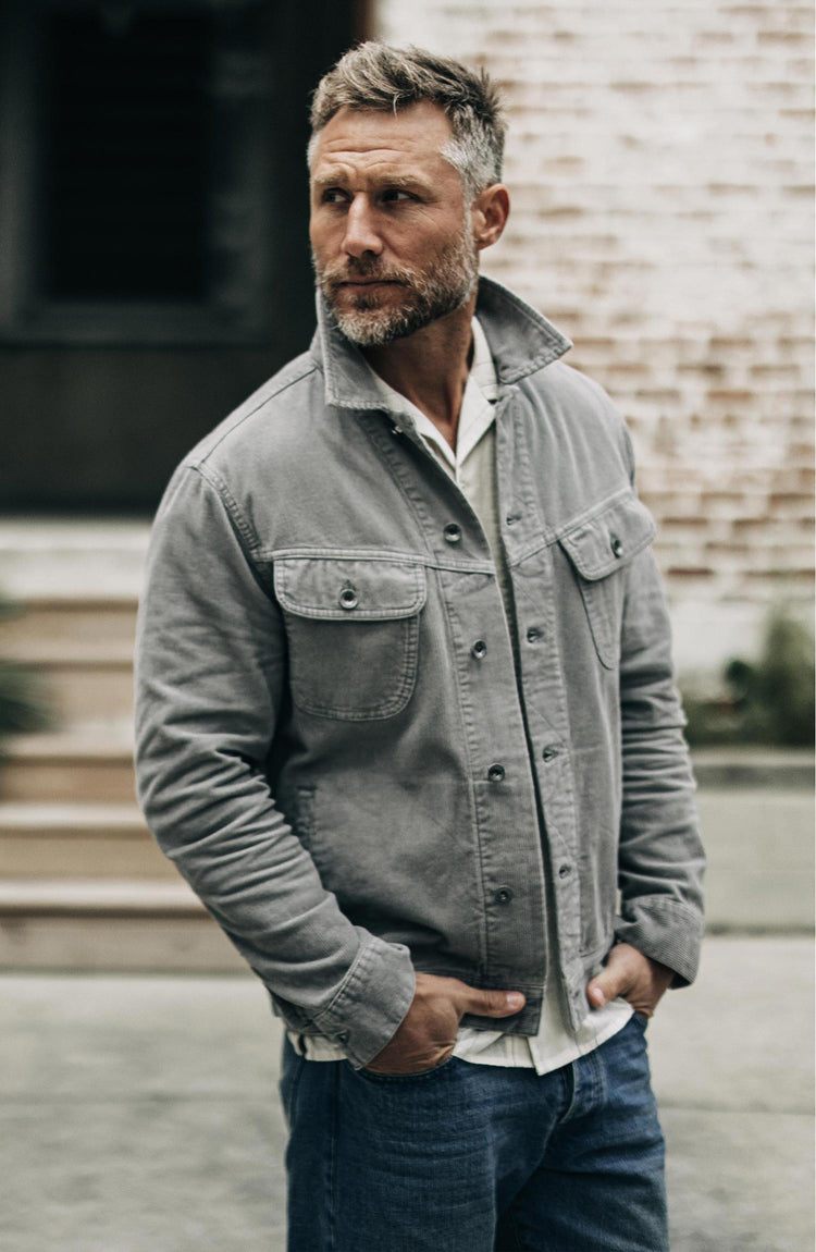 Our model wearing the long haul jacket in steeple grey