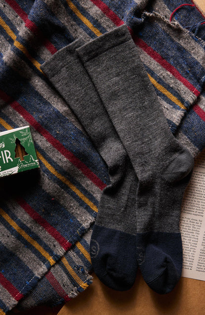 flatlay of The Merino Sock in Charcoal next to incense