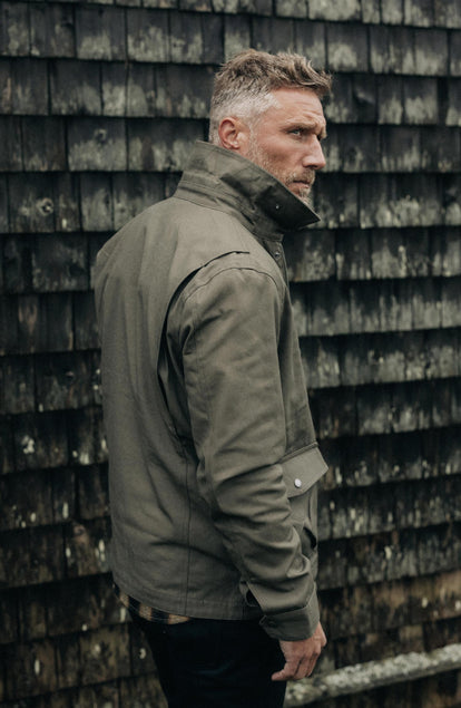 fit model showing off collar on The Pathfinder Jacket in Fatigue Olive Dry Wax