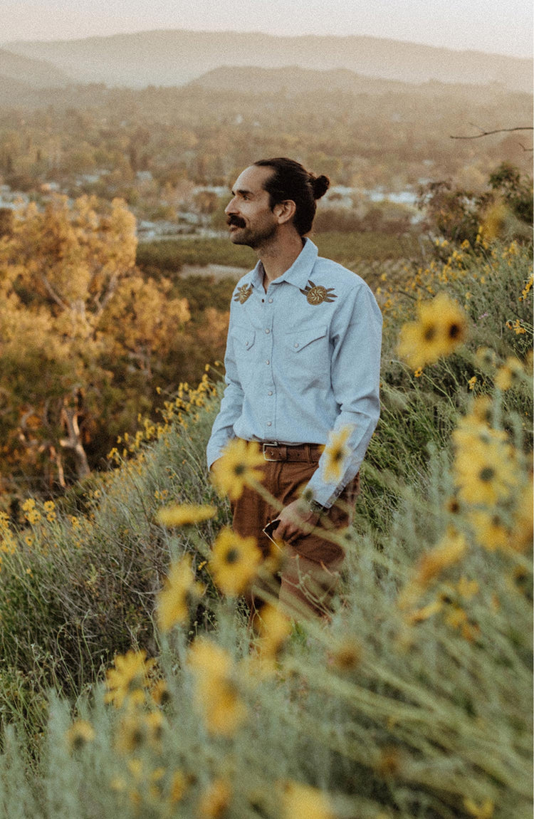 Daren standing in a field.