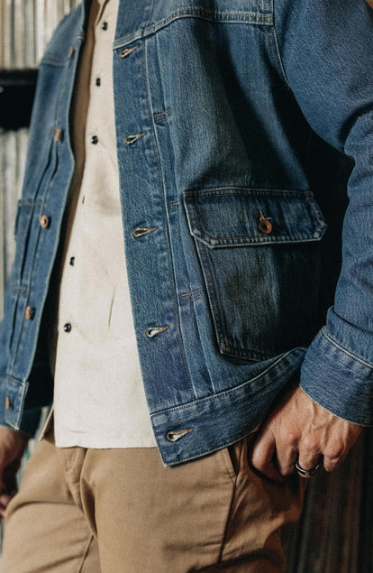 Our model standing in The Ryder Jacket in Sun Bleached Denim