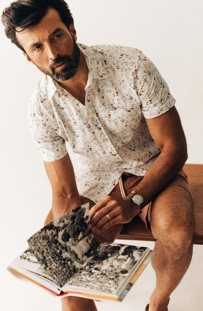 fit model sitting wearing The Short Sleeve California in Vintage Botanical