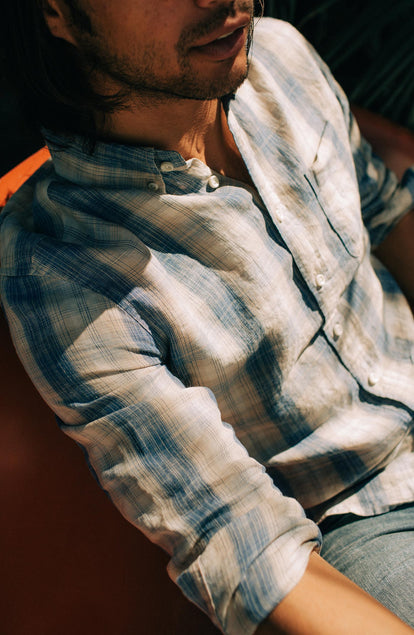 fit model sitting in the jack in iceberg plaid