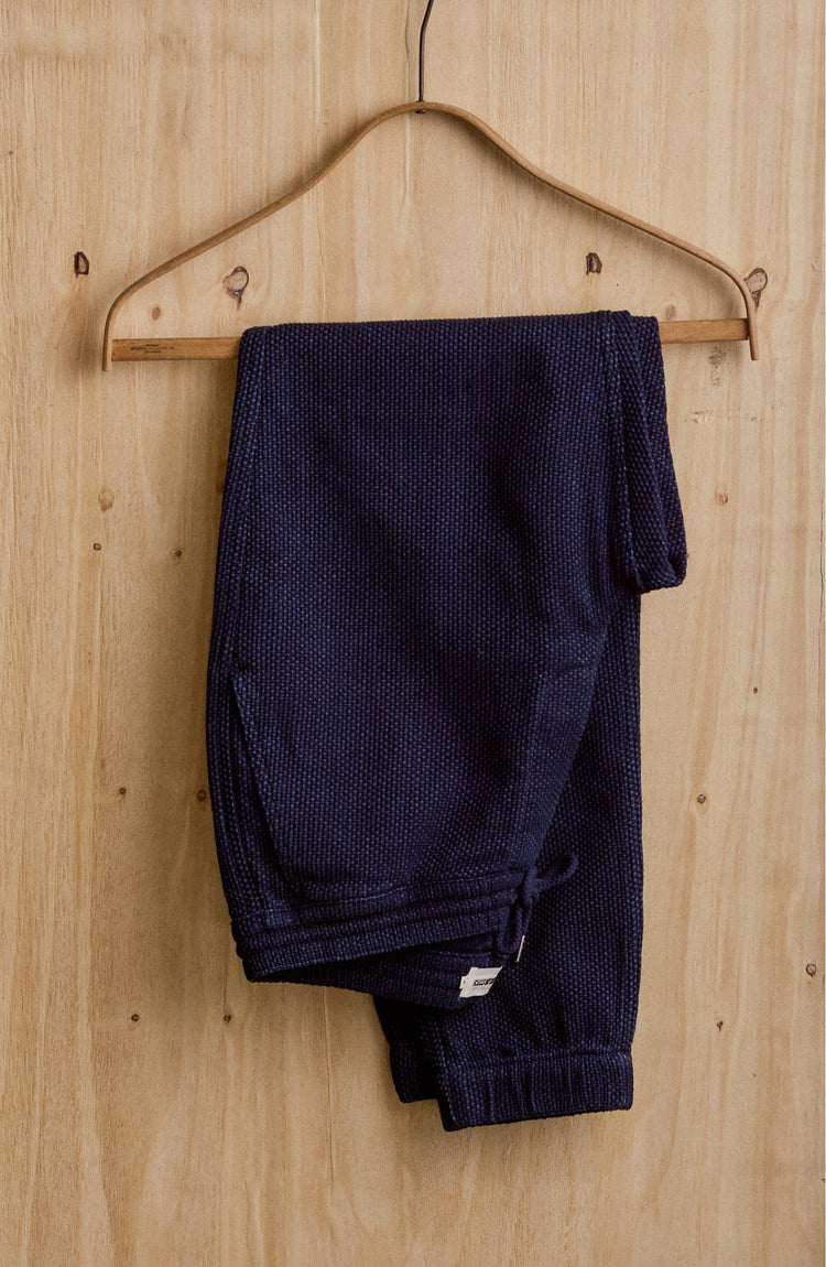 editorial image of The Apres Pant in Rinsed Indigo Sashiko hanging