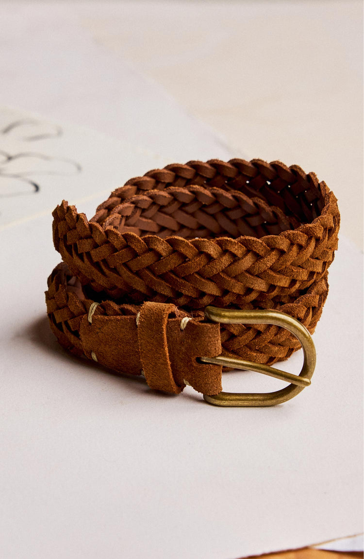 editorial image of The Braided Belt in Tan Suede rolled up