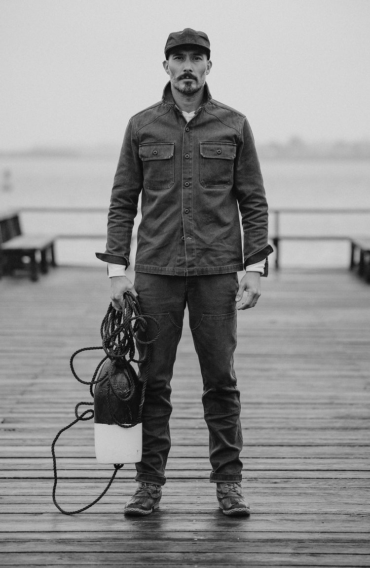 Model throwing a fishing line into the sea