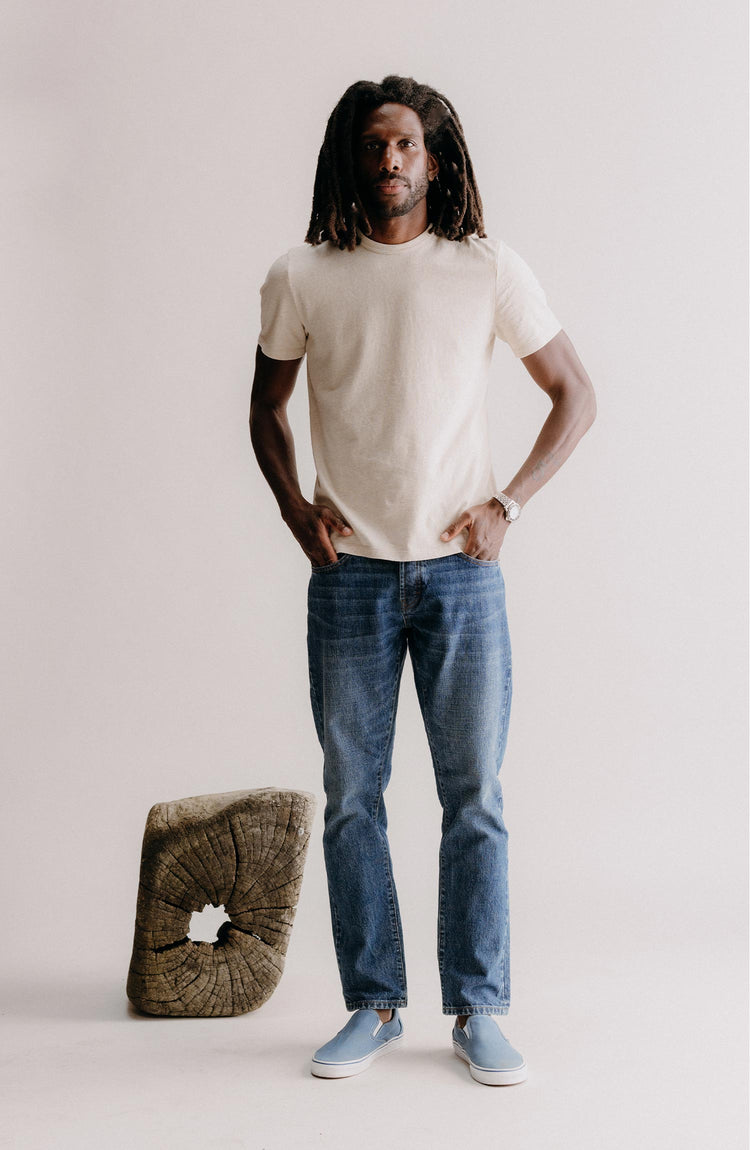 fit model posing in The Democratic Jean in Mid Wash Organic Selvedge