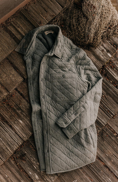 material shot of The Fall Line Overshirt in Heather Ash Quilted Jersey sitting on the ground