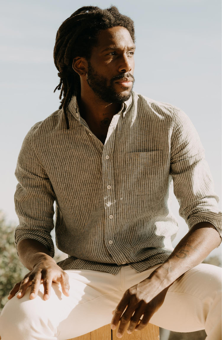 fit model sitting wearing The Jack in Cilantro Stripe Linen