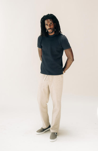 fit model posing in The Organic Cotton Short Sleeve Crew in Dark Navy Waffle