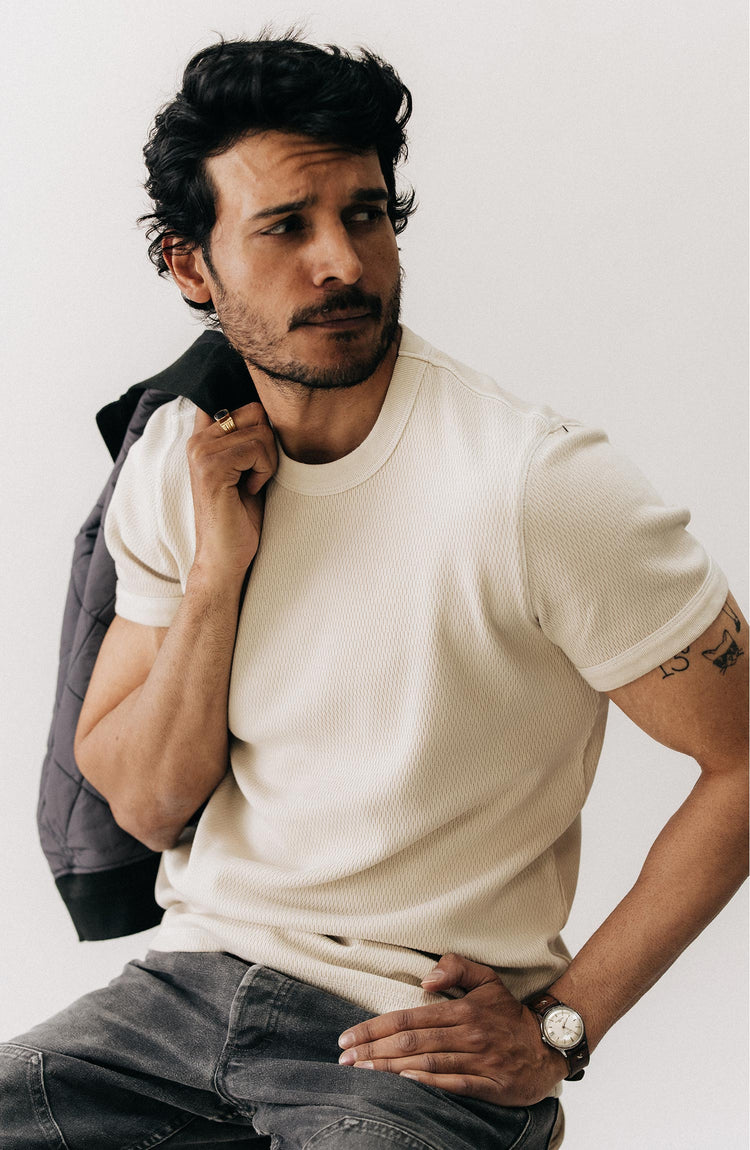 fit model sitting wearing The Organic Cotton Short Sleeve Crew in Vintage White Waffle