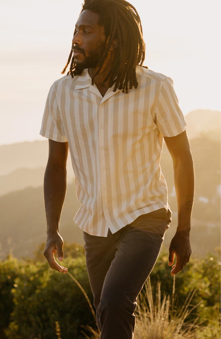 fit model walking wearing The Short Sleeve Davis Shirt in Sandbar Stripe