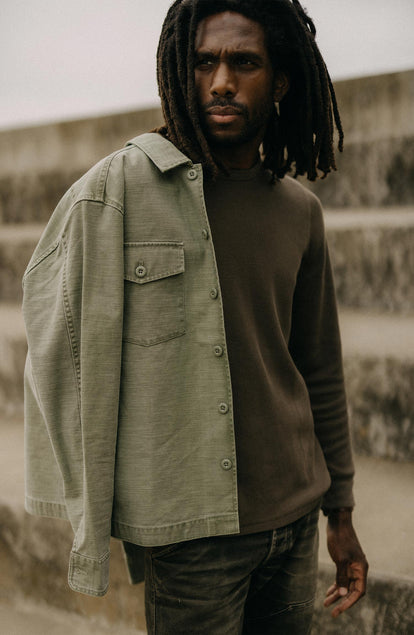 fit model with The Surplus Shirt in Field Olive Reverse Sateen over his shoulder