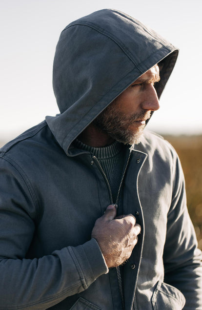 Our model standing in the workhorse hoodie in gravel boss duck