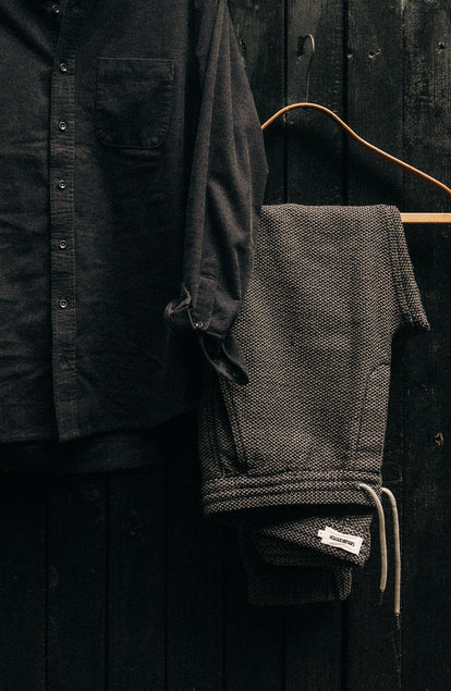 editorial image of The Apres Pant in Charcoal Sashiko hanging