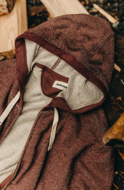 editorial flatlay of The Apres Zip Hoodie in Merlot French Terry Twill