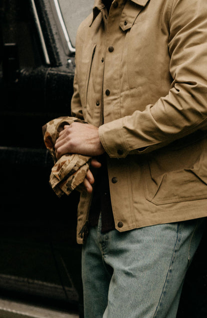 fit model wiping his hands with The Bandana in Arid Camo