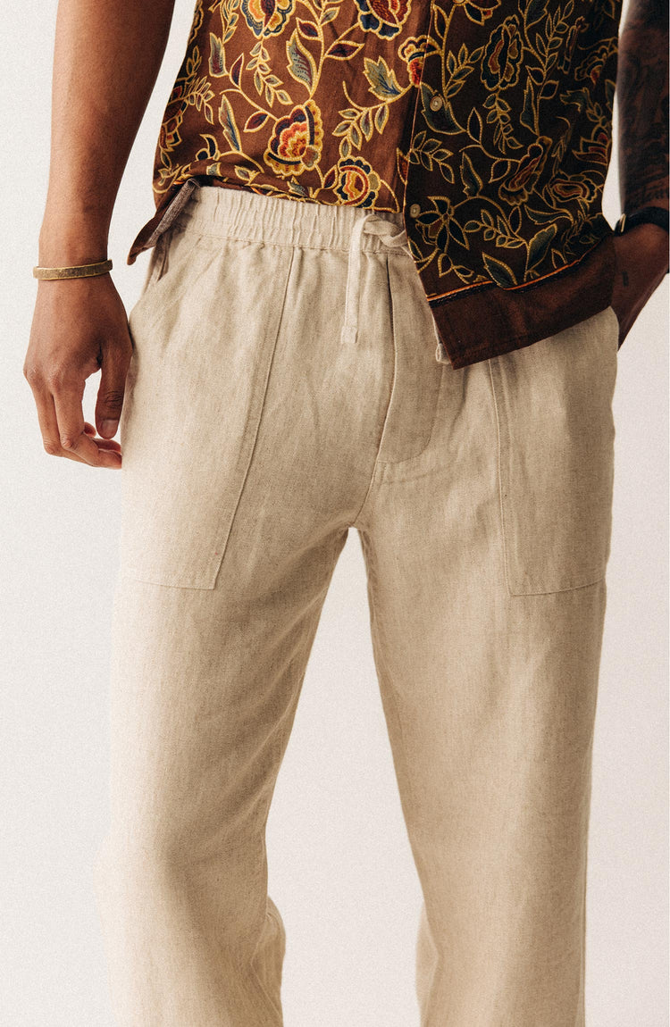 fit model with his hand in the pocket of The Breakwater Pant in Natural Herringbone