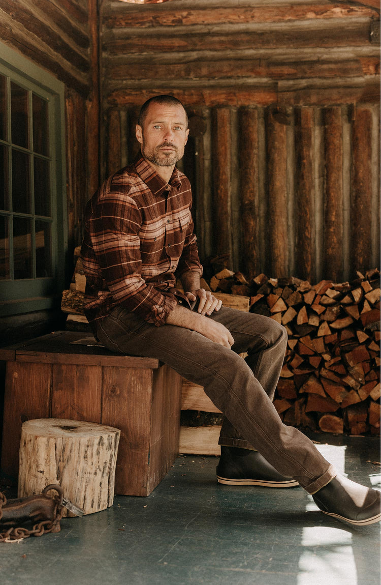 fit model sitting wearing The Camp Pant in Aged Penny Chipped Canvas