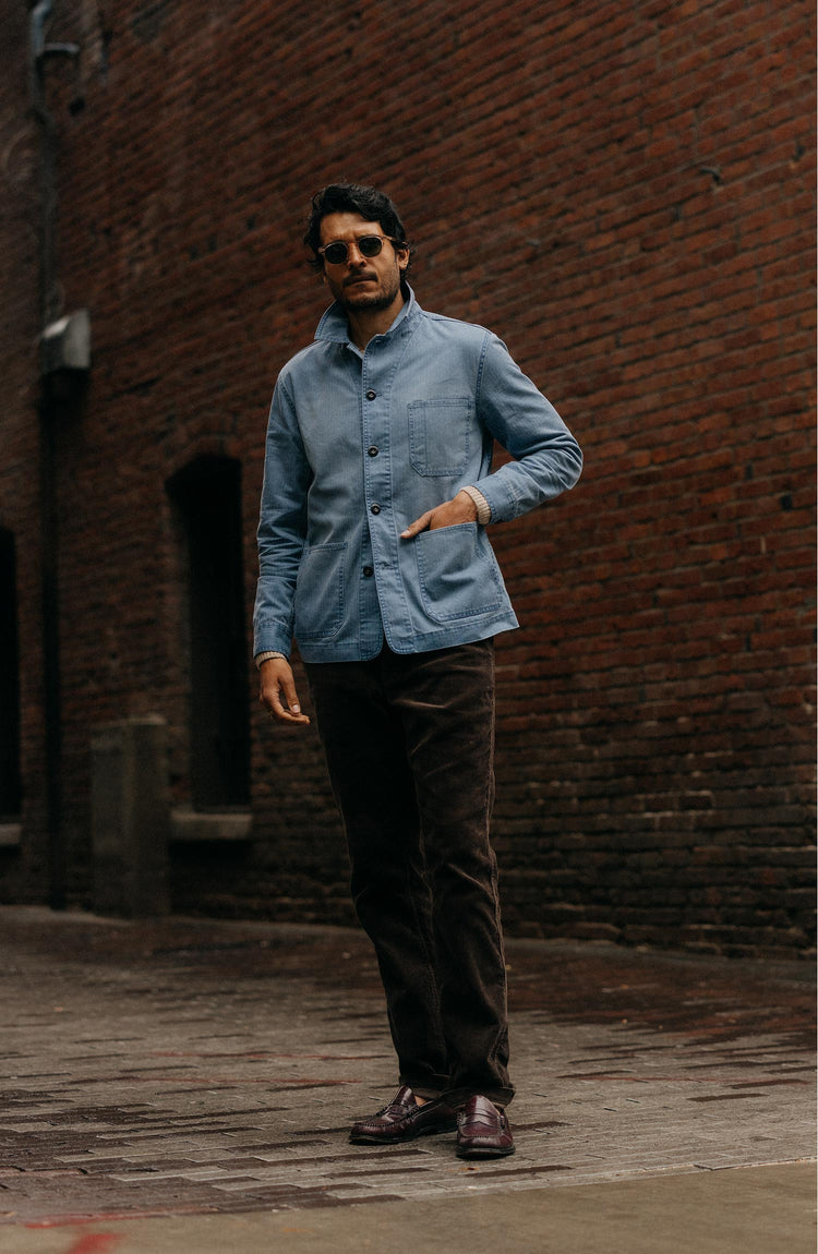 fit model walking wearing The Carnegie Pant in Soil Corduroy