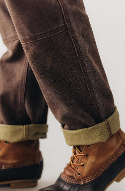 fit model showing off the cuffs on The Chore Pant in Aged Penny Chipped Canvas