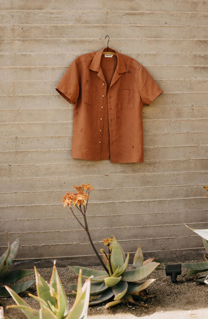 editorial image of The Conrad Shirt in Adobe Embroidery on a hanger