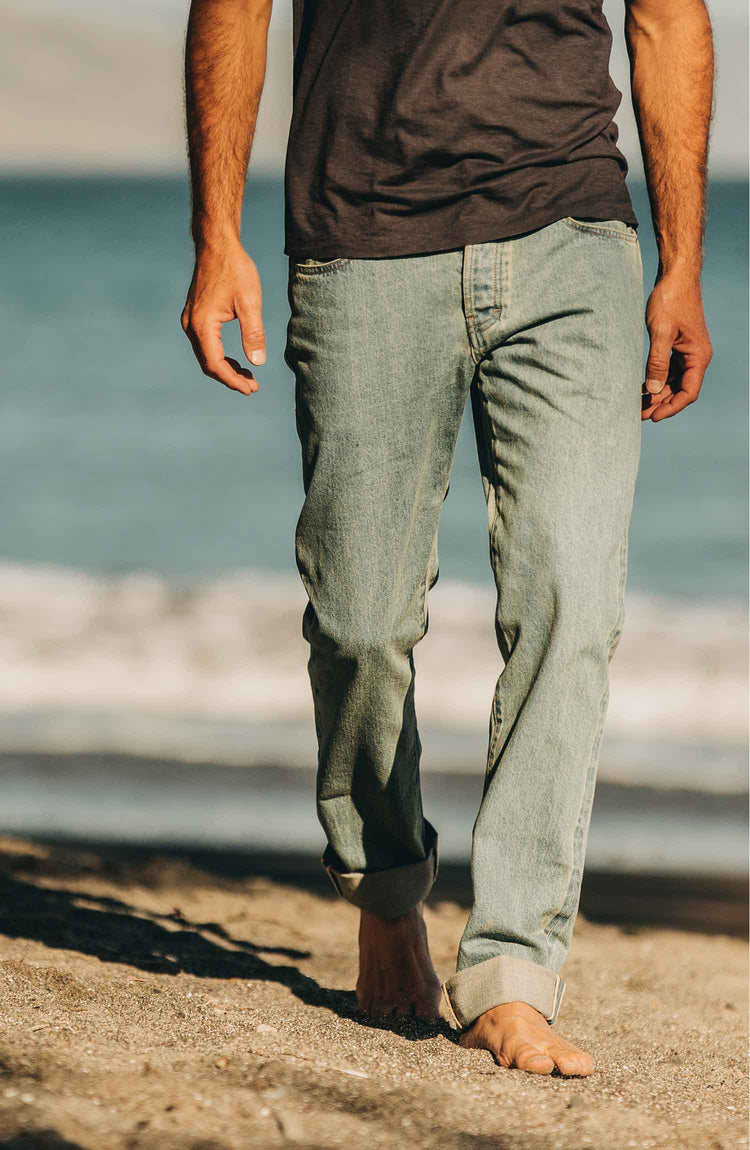 our fit model wearing the 24 month wash denim on the beach