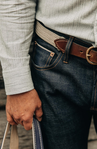 our fit model wearing the democratic jean, cropped shot with text on the right