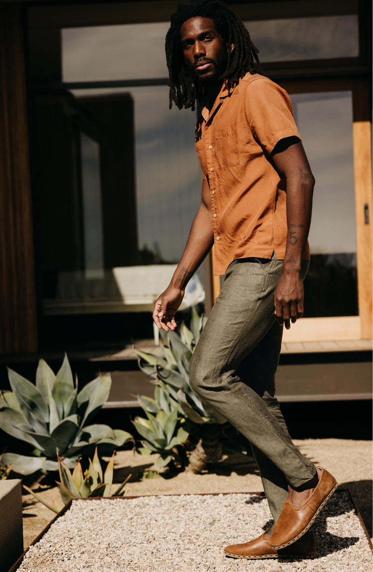 fit model walking wearing The Easy Pant in Olive Linen